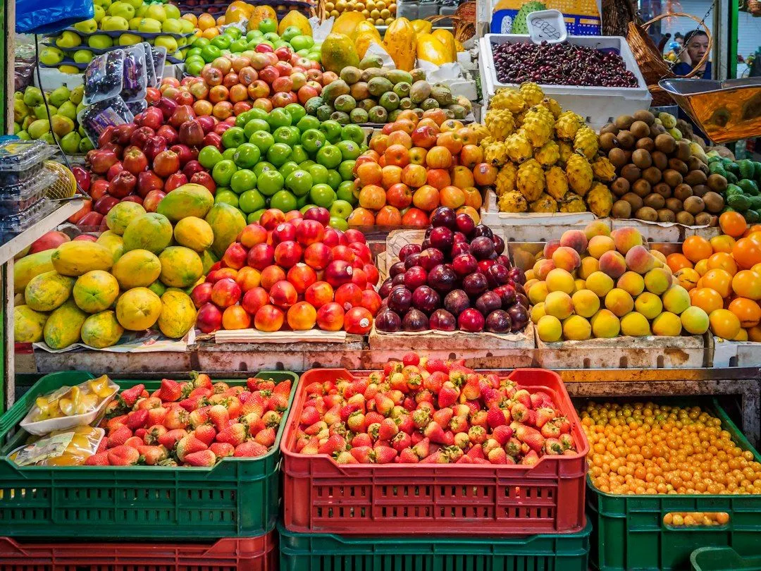 red and green apples on red plastic crate