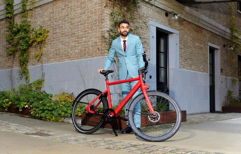 man standing next to a cortina e-Lett work bike.